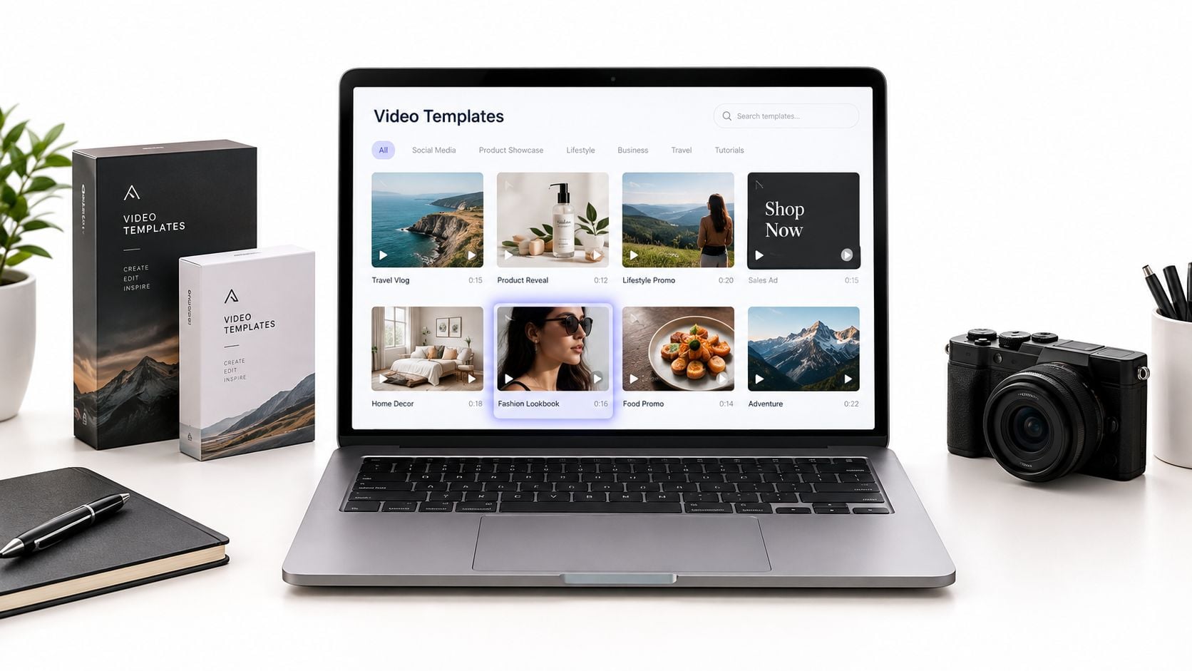 A modern laptop displaying video templates on a desk next to product boxes and a camera.